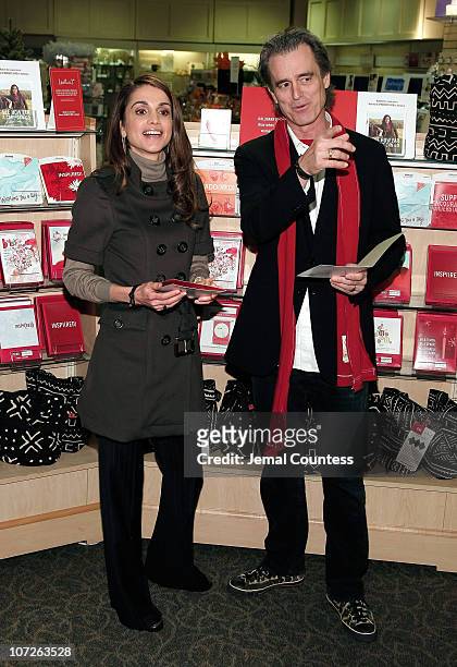 Her Majesty Queen Rania Al Abdullah of Jordan and RED Co-Founder Bobby Shriver make an appearence at the LeMarc's Hallmark Gold Crown Store on...