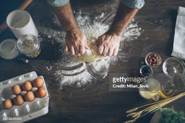 pastry chef kneading dough - baker stock pictures, royalty-free photos & images