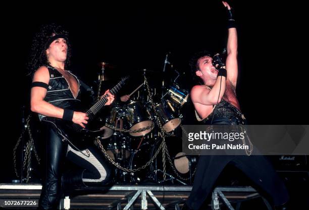 Guitarist Michael Wilton, left, and singer Geoff Tate of Queensryche perform at the Milwaukee Arena in Milwaukee, Wisconsin, December 30, 1984.