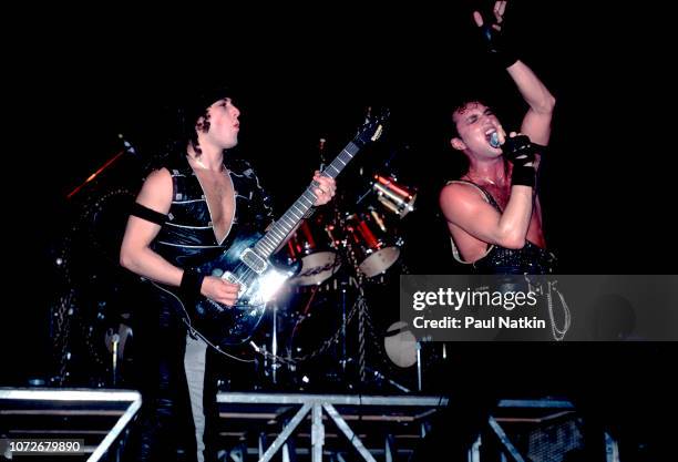 Guitarist Michael Wilton, left, and singer Geoff Tate of Queensryche perform at the Milwaukee Arena in Milwaukee, Wisconsin, December 30, 1984.