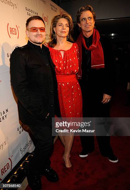 Musician Bono, Queen Noor and Bobby Shriver arrive at Sotheby's, Bono and Damien Hirst Host The Auction to Benefit AIDS in Africa on February 14,...