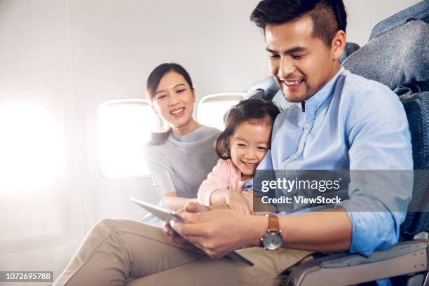 happy families by plane - first class plane stock-fotos und bilder