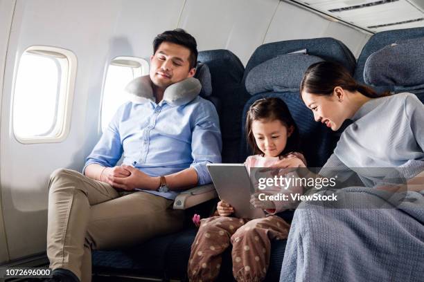 happy families by plane - first class plane stock-fotos und bilder