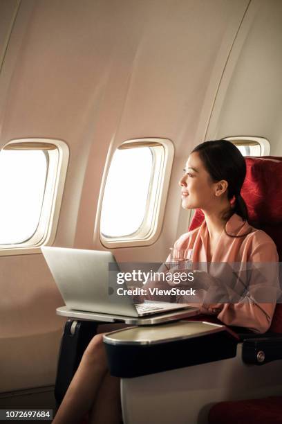 business women by plane - first class plane stock-fotos und bilder