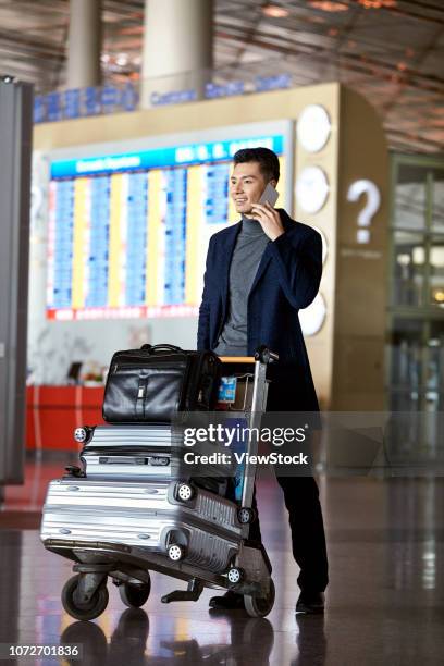 business man at the airport - luggage trolley stock pictures, royalty-free photos & images