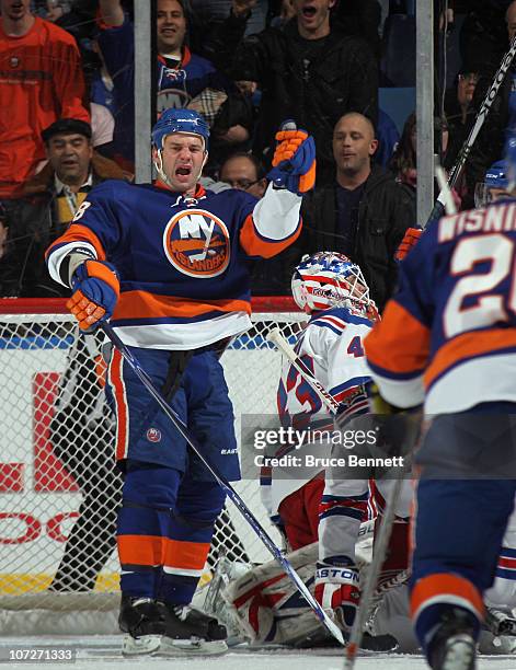 Zenon Konopka of the New York Islanders scores at 19:11 of the first period against the New York Rangers at the Nassau Coliseum on December 2, 2010...