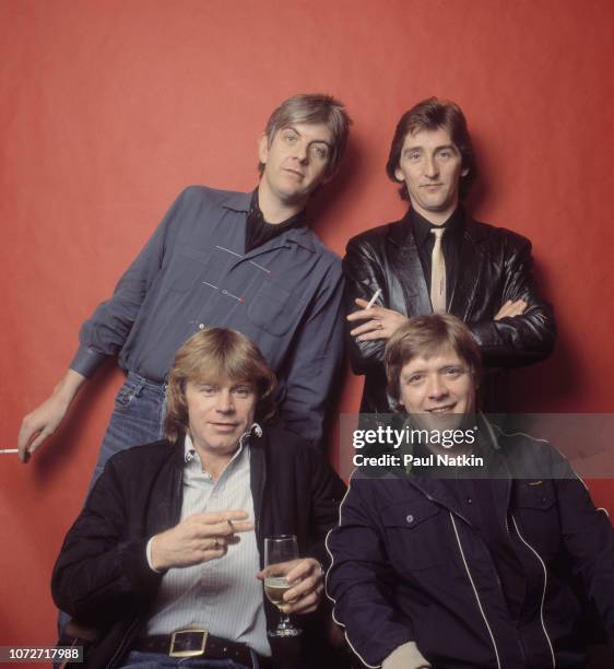 Portrait of the band Rockpile, clockwise from lower left, Dave Edmunds, Nick Lowe, Terry Williams, and Billy Bremner at the Riviera Theater in...