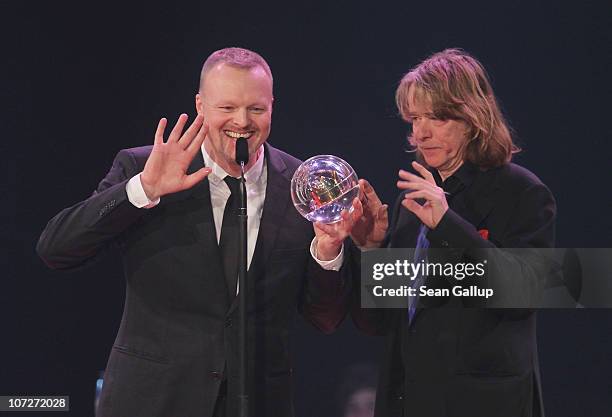Entertainer Stefan Raab receives his Special Award from comedian Helge Schneider at the '1Live Krone' music awards at the Jahrhunderthalle on...