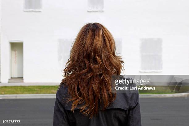 woman with tussled long hair - brown hair stock pictures, royalty-free photos & images