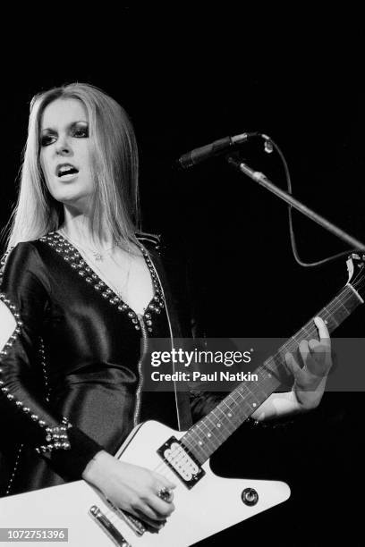 British-born American musician Lita Ford, of the Runaways, plays guitar as she performs onstage at the Aragon Ballroom, Chicago, Illinois, January...