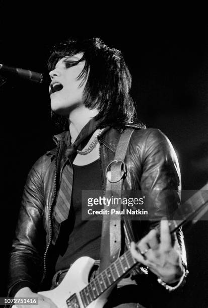 American musician Joan Jett , of the Runaways, plays guitar as she performs onstage at the Aragon Ballroom, Chicago, Illinois, January 20, 1978.