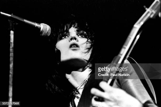 American musician Joan Jett , of the Runaways, plays guitar as she performs onstage at the Aragon Ballroom, Chicago, Illinois, March 25, 1977.