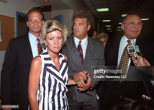 Attorney Ed Shulman , Mary Jo Buttafuoco and Joey Buttafuoco and his attorney Marvyn Kornberg , leave court during lunch recess on July 20, 1993 in...