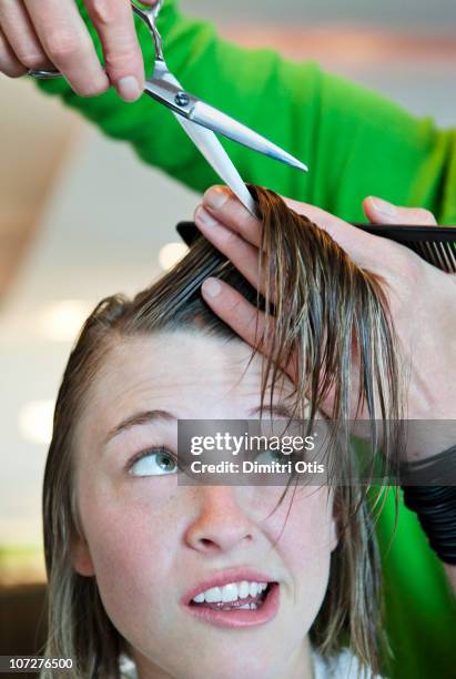 woman having her fringe cut short - fringe stock pictures, royalty-free photos & images