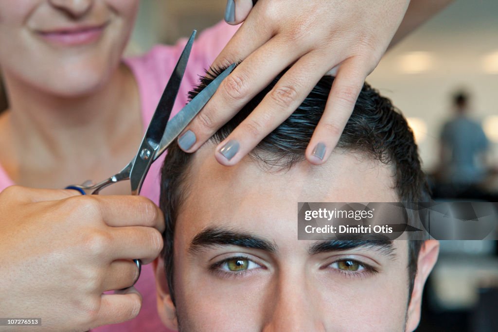 Man having hair cut, closeup