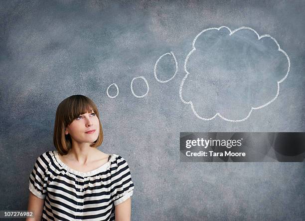 woman with thought bubble on chalk board - betrachtung stock-fotos und bilder