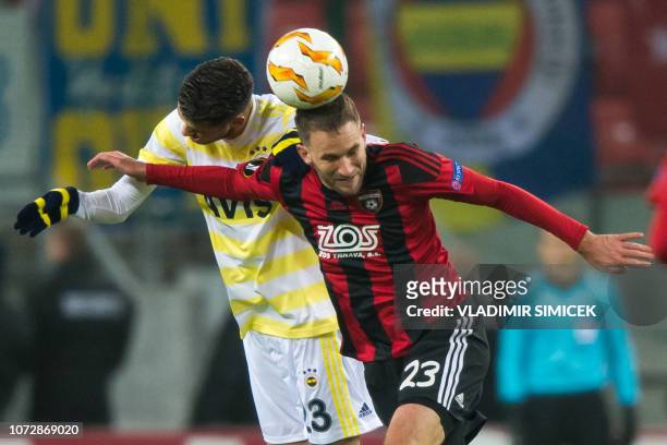 Fenerbahces Mexican defender Diego Reyes and Trnavas Slovak forward Marek Bakos vie for the ball during the UEFA Europa League Group D football match...
