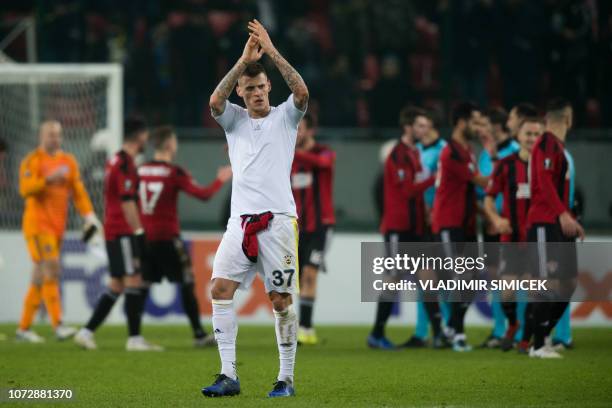 Fenerbahce's Slovak defender Martin Skrtel greets supporters at the end of the UEFA Europa League Group D football match between Spartak Trnava and...