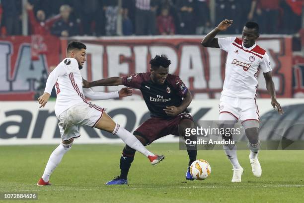 Mohamed Camara and Miguel Angel Guerrero of Olympiacos in action against Franck Kessie of AC Milan during the UEFA Europa League Group F match...