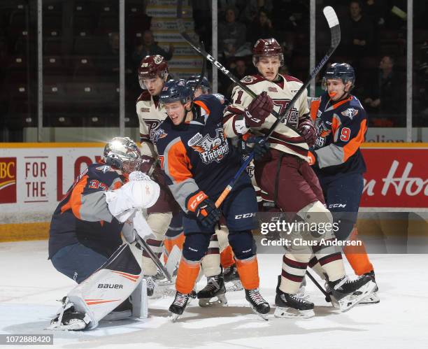 Riley McCourt of the Flint Firebirds battles against Cameron Butler of the Peterborough Petes in an OHL game at the Peterborough Memorial Centre on...