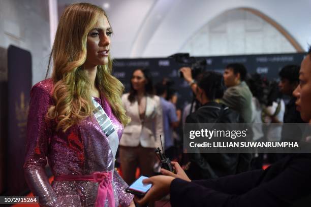 Angela Ponce of Spain speaks during an interview with journalists at a media event of 2018 Miss Universe pageant in Bangkok on December 14, 2018....