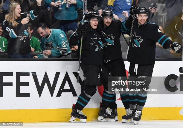 Timo Meier, Erik Karlsson and Brenden Dillon of the San Jose Sharks celebrate a goal against the Dallas Stars at SAP Center on December 13, 2018 in...