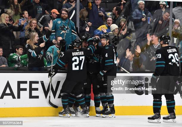 Joonas Donskoi, Timo Meier, Erik Karlsson and Brenden Dillon of the San Jose Sharks celebrate a goal against the Dallas Stars at SAP Center on...