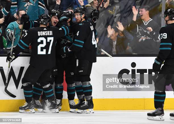 Joonas Donskoi, Timo Meier, Erik Karlsson and Brenden Dillon of the San Jose Sharks celebrate a goal against the Dallas Stars at SAP Center on...