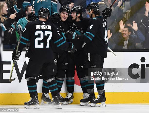 Joonas Donskoi, Timo Meier, Erik Karlsson and Brenden Dillon of the San Jose Sharks celebrate a goal against the Dallas Stars at SAP Center on...