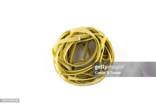 nest pasta isolated on white background - spaghetti hoops stock pictures, royalty-free photos & images