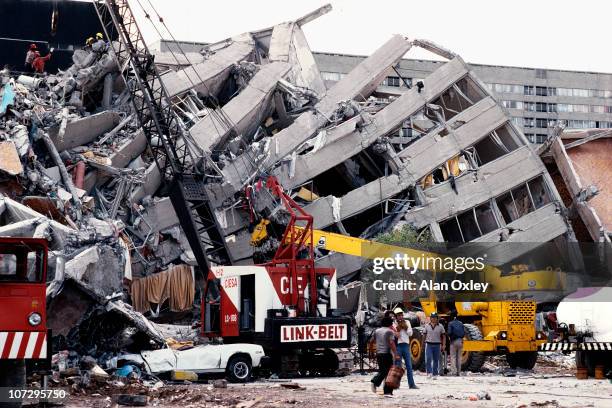 Toppled by one of the deadliest earthquakes of the century, Mexico City apartment buildings lie on their backs in September, 1985. The quake which...