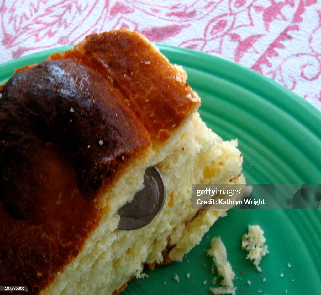 Greek vassilopita bread slice with lucky dime