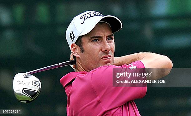 England's Ross Fisher watches his shot out of a bunker on the 7th hole during the 2nd day of the Nedbank Golf Challenge in Sun City on December 03,...