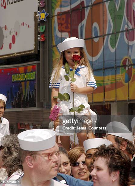 Young fan comes to Times Square to witness the reenactment of "The Kiss".