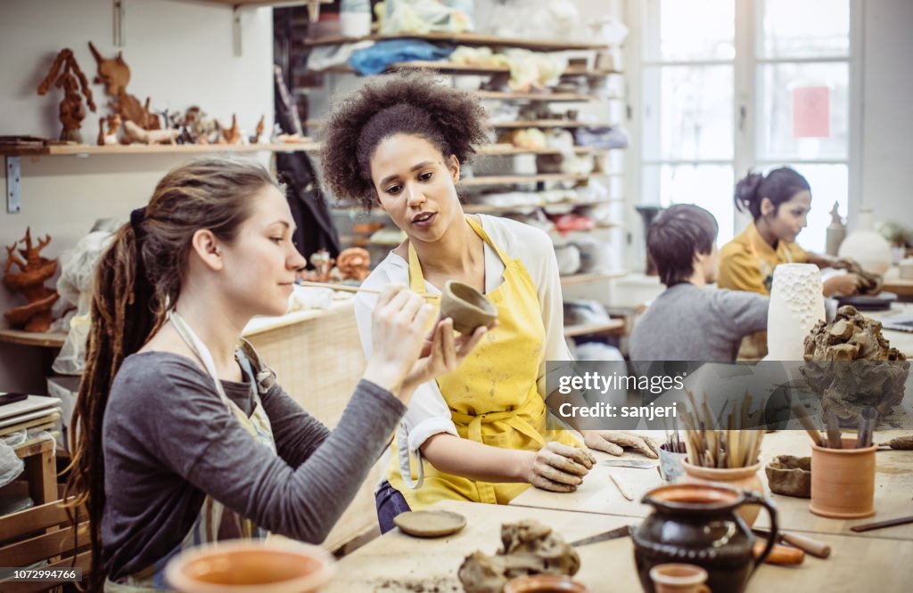 Group of Young Students Making Pottery