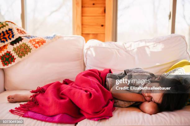 girl sleeping on a couch - lower bildbanksfoton och bilder