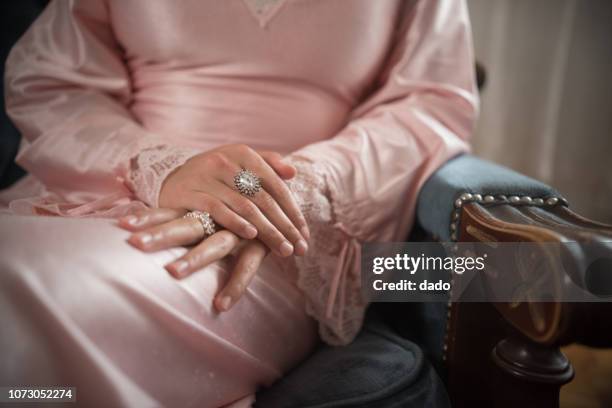 close-up of diamond rings on a woman's hands - diamante 個照片及圖片檔