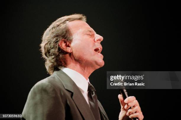 Spanish singer Julio Iglesias performs live on stage at Wembley Arena in London on 4th June 1995.