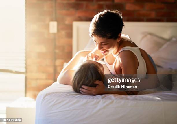 this should get you up... - lesbian bed stock pictures, royalty-free photos & images
