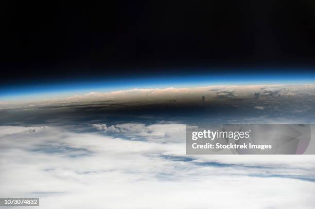 the 2017 solar eclipse as viewed from the international space station. - iss window stock pictures, royalty-free photos & images