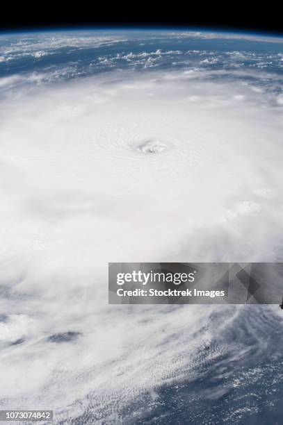 the eye of hurricane irma as seen from the international space station. - ceres dwarf planet stock illustrations