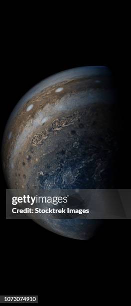 enhanced color view of planet jupiter's stormy atmosphere. - south pole stock pictures, royalty-free photos & images