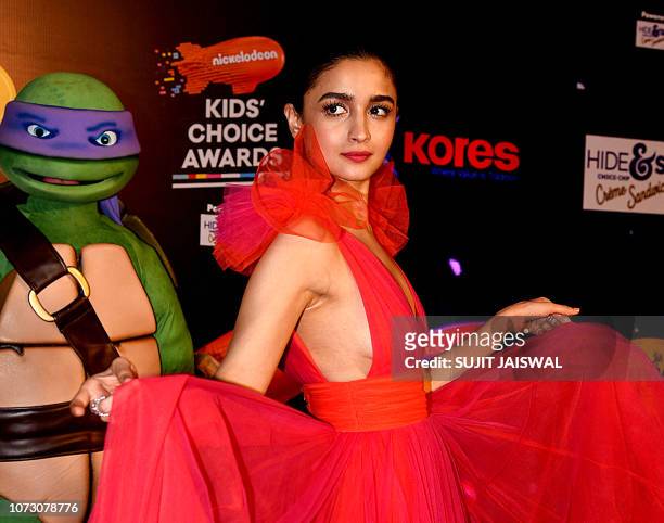 Indian Bollywood actress Alia Bhatt poses for photographs at the annual Nickelodeon Kids' Choice Awards ceremony in Mumbai on December 13, 2018.