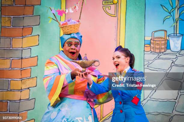 Clive Rowe as Widow Twankey and Gemma Sutton as Aladdin pose during a photocall for Hackney Empire's 20th Anniversary pantomime "Aladdin" at Hackney...