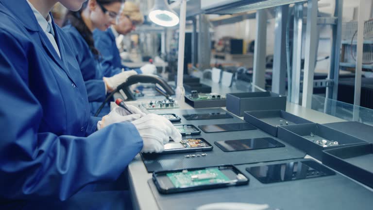 https://media.gettyimages.com/id/1073124264/video/female-electronics-factory-worker-in-blue-work-coat-and-protective-glasses-is-assembling.jpg?b=1&s=640x640&k=20&c=BSOPLcwdknyarTvOpvHNfWEL0YdAczkeZEwgx6QiO0k=