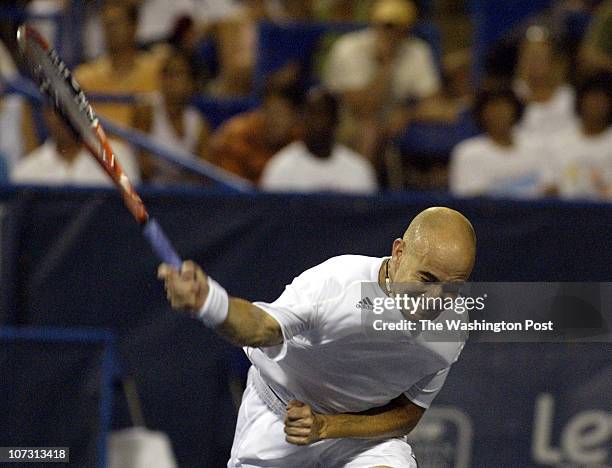 Sp_legg1 8/1/06 182607 LEGG MASON TENNIS CLASSIC Post Photos by Rich Lipski (ANDRE AGASSI VS ANDREA STOPPINI Andre Agassi puts his all into slamming...