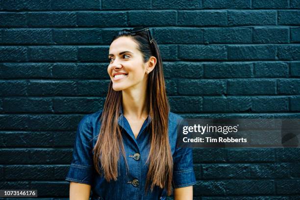 woman smiling off camera - long live our independence stock pictures, royalty-free photos & images