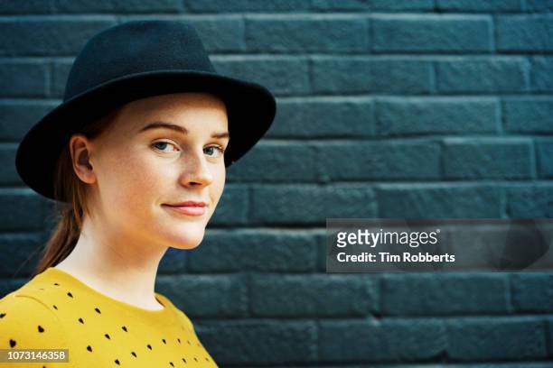 young woman in hat looking at camera, smiling. - true peoples celebration day one stock pictures, royalty-free photos & images