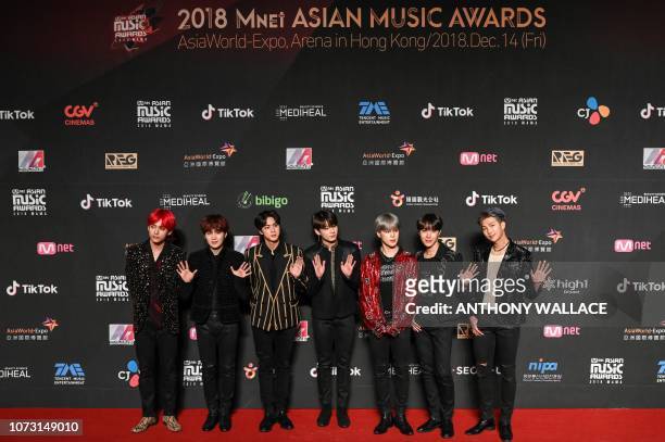 South Korean boy band BTS, also known as the Bangtan Boys, pose on the red carpet at the Mnet Asian Music Awards in Hong Kong on December 14, 2018.