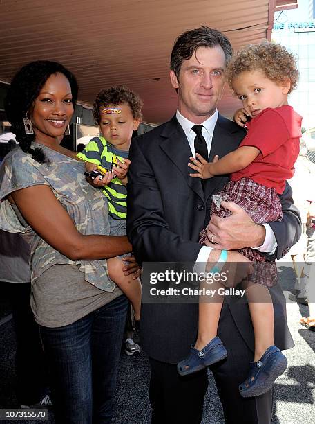 Actress Garcelle Beauvais, husband Mike Nilon, children Jax Nilon and Jaid Nilon attend Disney/Pixar "World Of Cars Online" launch event held at...